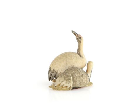 A small ivory okimono of a pair of red-crowned tsuru, 5cm high, 19th or 20th CenturyProvenance: The Property of a Lady. From 