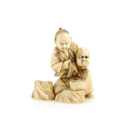 A slightly stained, sectional ivory okimono of a seated mask maker, 6.5 cm high, Meiji PeriodProvenance: The Property of a La