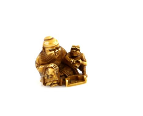 A stained ivory netsuke of Shoki and an Oni, 20th CenturyProvenance: The Property of a Lady. From a Private Collection acquir