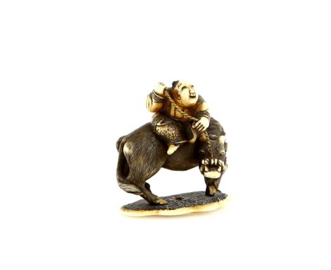 An ivory netsuke of a boy seated on a water buffalo; the base with a single himotoshi; signed HoshinsaiProvenance: The Proper