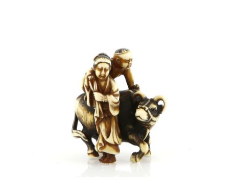 A heavily stained ivory netsuke, carved as a child on a water buffalo beside a standing women, signed Jushi, 20th CenturyProv