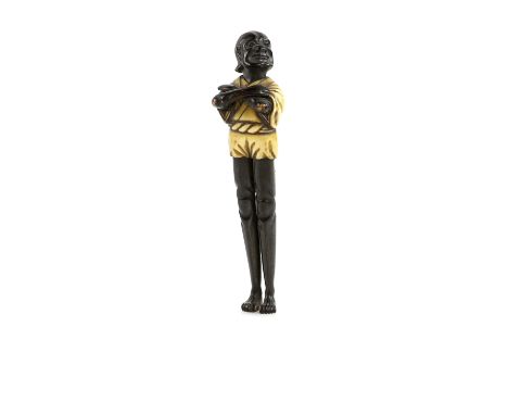 A tall ivory  and black figure netsuke with himotoshi on the back, possibly intended as a parody of Ashinaga with his long le