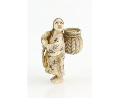 A small ivory netsuke carved as a standing girl holding a basket on her back, signed Gyokusai, 20th CenturyProvenance: The Pr