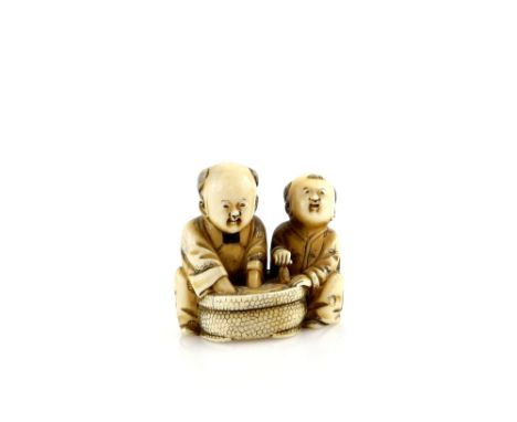 An ivory netsuke of two boys beside a circular tub of water, signed HominProvenance: The Property of a Lady. From a Private C