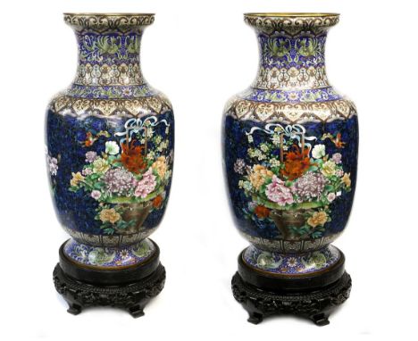  A  large and impressive pair of cloisonne enamel vases; each one with flaring trumpet neck and cylindrical body, decorated w