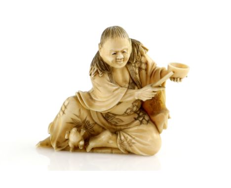 A stained ivory okimono carved as Gama Sennin beside his magical toad, unsigned, 7.5 cm high, Meiji PeriodProvenance: The Pro