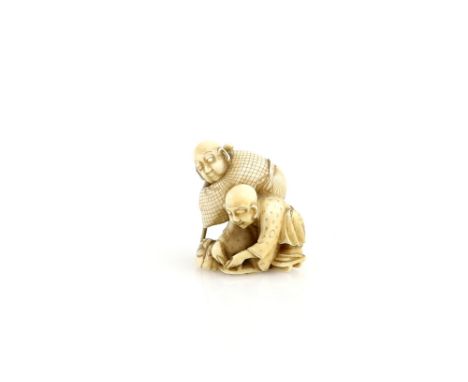 An ivory netsuke of two blind masseurs; one holding a staff with both hands and the other tying up his geta, 19th CenturyProv