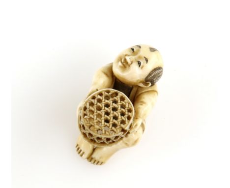 A stained ivory netsuke of a boy with a reticulated basket, signed ToshimasaProvenance: The Property of a Lady. From a Privat