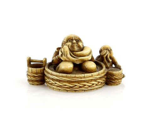 A stained ivory netsuke carved as Hotei kneeling in a large circular tub beside  a boy washing his face; signed NorishigeProv