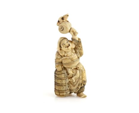 A stained ivory okimono carved as Daikoku holding up his Magic Mallet, nearly 10cm high, 20th CenturyProvenance: The Property