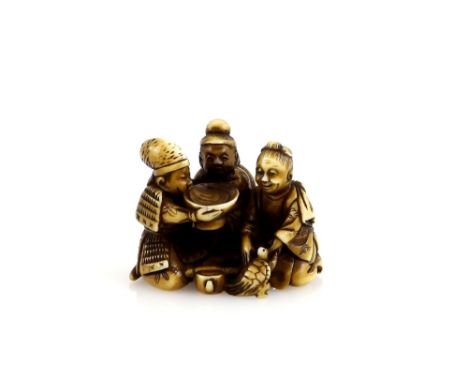 A stained ivory netsuke carved as Three Sake tasters with  a large sakazuki; one of the drinkers with a Minogame, presumably 