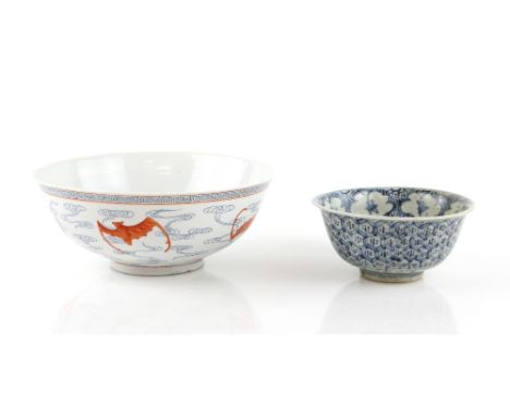 An underglaze blue and orange bowl, decorated with bats amongst clouds, 23 cm diameter, the base with four-character Kangxi n