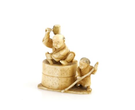 An ivory okimono carved as a mill-stone mason with a mallet in his right hand, a boy apprentice at his left; 6cm wide, 19th o