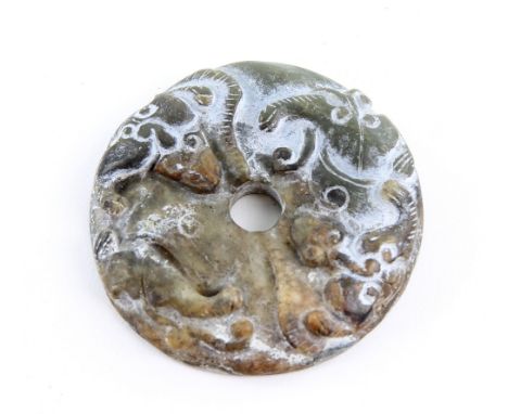 Chinese green/brown jade disc carved with bats to one side, interlocking scrolling decoration to the other, 6cm diameter, and