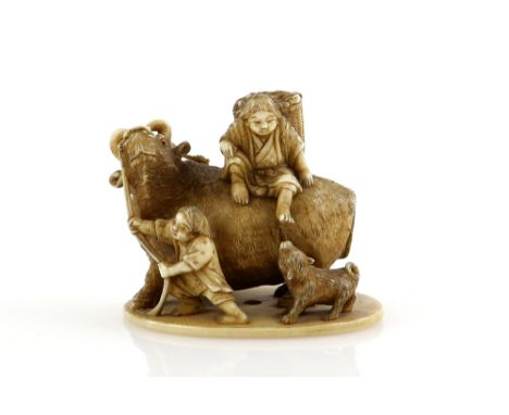 An okimono style netsuke with single himotoshi, carved as three farmers and a dog with a large bull, signed Hogyoku Provenanc