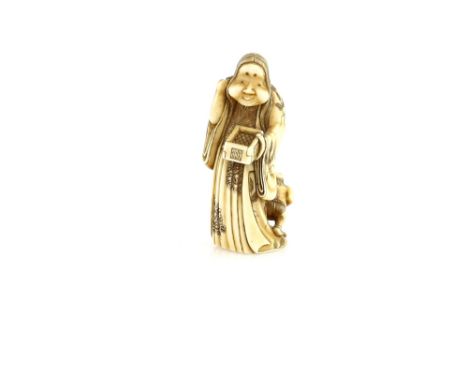 An ivory netsuke or small okimono of Okame, throwing Soy beans during the Annual Setsubun Festival on February 3rd; an Oni hi