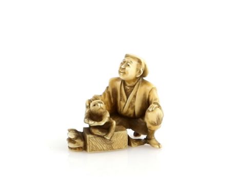 A stained ivory netsuke of a Sarumawashi, 19th or 20th CenturyProvenance: The Property of a Lady. From a Private Collection a