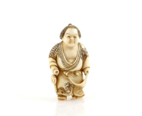 A stained ivory netsuke of a Sekitori holding up the hem of his kimono with his left hand, and holding a sagemono with his ri