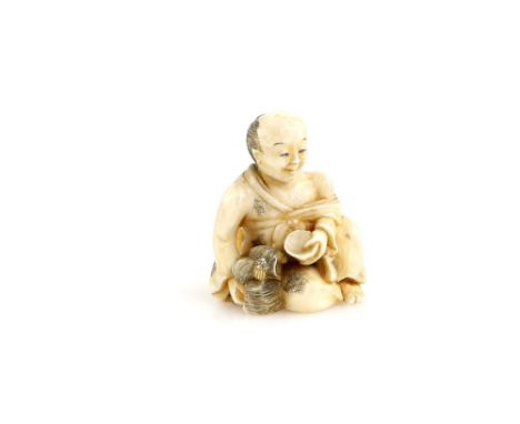 A stained ivory netsuke of a seated Onnagata holding his wig with the right hand and a sakazuki or chawan with the left handP