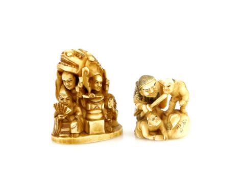 A stained ivory netsuke of Shoki with two Oni; and a small okimono of a Shishimai Dancer and street entertainers; the last 6 