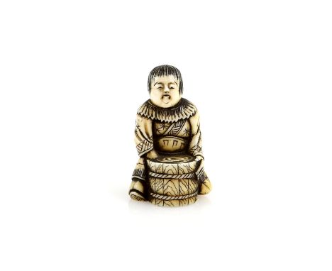 A stained ivory netsuke of a boy beside a mortar, 19th CenturyProvenance: The Property of a Lady. From a Private Collection a