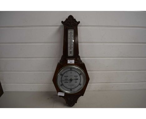 EARLY 20TH CENTURY OAK CASED BAROMETER AND THERMOMETER COMBINATION BEARING RETAILERS MARK FOR HARVEY OF WELLINGTON