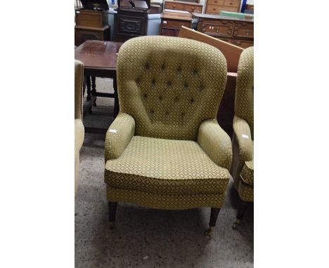 20TH CENTURY BUTTON BACK ARMCHAIR, UPHOLSTERED IN CHEQUERED FABRIC, RAISED ON TAPERING LEGS WITH BRASS CASTERS