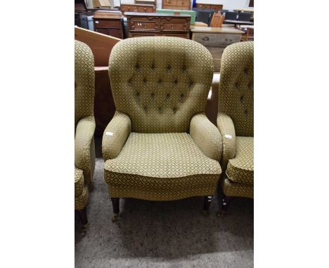20TH CENTURY BUTTON BACK ARMCHAIR, UPHOLSTERED IN CHEQUERED FABRIC, RAISED ON TAPERING LEGS WITH BRASS CASTERS