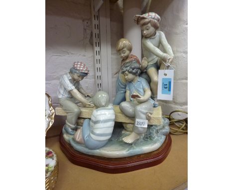 Nao figure group of boys playing cards, on wooden base H33cm