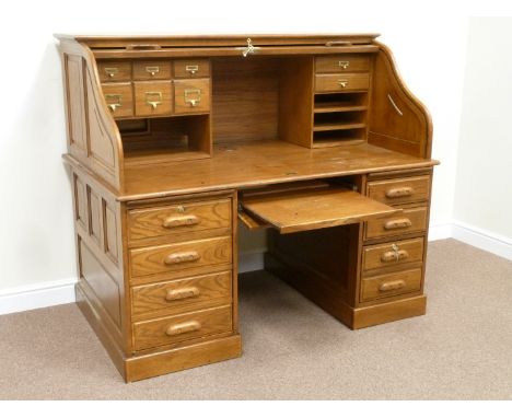 Reproduction light oak twin pedestal tambour roll top desk with fitted interior, W152cm