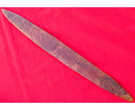 West Australian Aboriginal bullroarer message stick. Features desert hardwood, decorated with intricate zig zag lines on one 