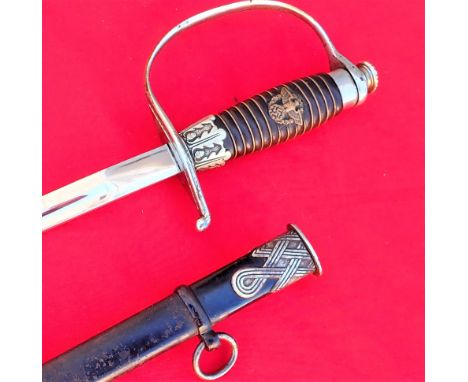 German WW2 Police officer’s sword and scabbard by Hermann Rath of Solingen. Solid brown composite grip with wire wrap, brass 