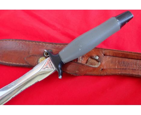 Vietnam War 1974 US Gerber Mark 2 fighting knife. Correct black and grey aluminium handle and light brown sheath. The ricasso