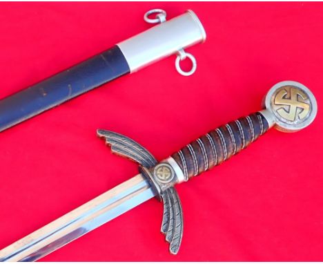 WW2 German Luftwaffe officer’s sword and scabbard by S.M.F of Solingen. Rotating brass swastika pommel, with slightly worn da