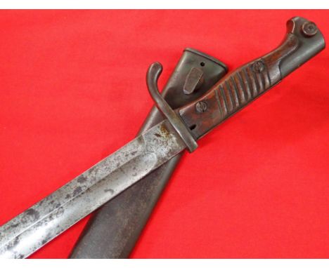 WWI 98/05 pattern German bayonet and scabbard by Alex Coppel of Solingen. 1918 dated bayonet features birds head pommel with 