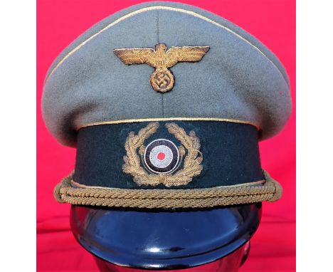 Scarce WW2 German Army General Officer’s peaked cap by Erel. 1943-45 example, featuring a very good black leather peak, field