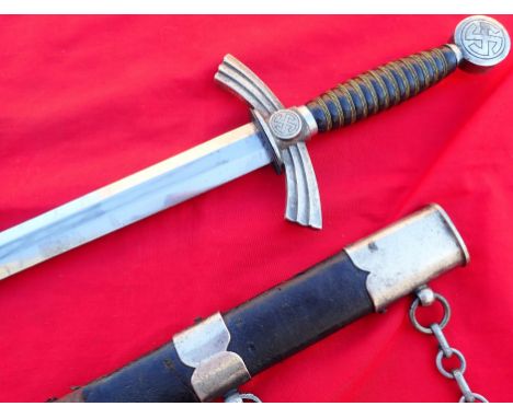 WW2 Germany Luftwaffe officer’s 1st type, 1st pattern dagger and scabbard with uniform hangers. Rotating worn swastika pommel