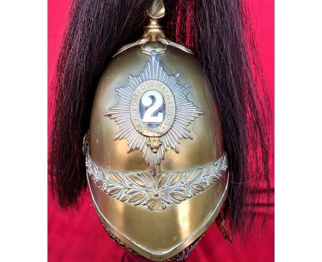 C.1900’s 1871 pattern British Army 2nd Dragoon Guards Trooper’s parade helmet. The brass skull has an embossed laurel wreath 