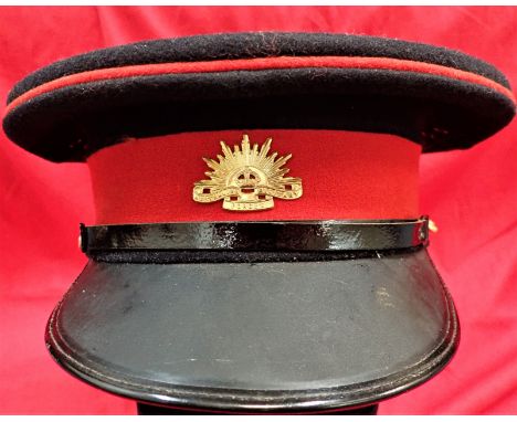 1940’s era Australian Army Patrol Blues officer’s peaked cap. Black wool body, red piped crown, red centre band with gilt K.C