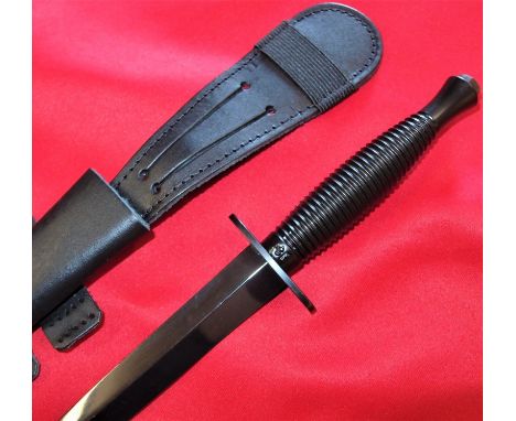 3rd pattern Fairbairn Sykes commando dagger with scabbard. Black enamel ribbed grip, maker marked for J. Nowill and Sons, She