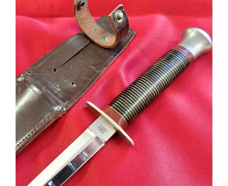 1950’s era Stiletto commando dagger and scabbard. Stacked brass &amp;amp; enamel ribbed grip, with nickel pommel &amp;amp; gu