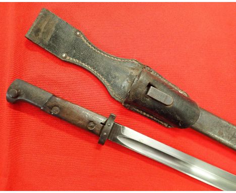 WW2 German converted 1924 pattern Czech Mauser bayonet and scabbard. Period wooden grips with working bayonet mounts, muzzle 