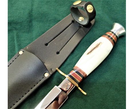 Stag gripped Stiletto commando dagger and leather sheath. Knife features a Scottish stag grip, stacked polished leather and b