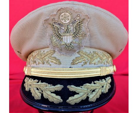 US Army ‘tropical’ General Officer’s peaked cap.Tan cotton body, with applied bullion US eagle motif badge, row of bullion oa