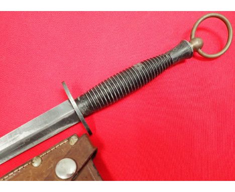 1960’s era Australian issue 3rd pattern Fairbairn Sykes commando dagger and scabbard. Black enamel brass ribbed grip, maker m