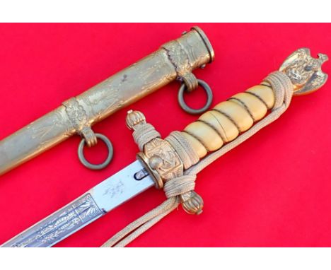 WW2 German Navy officer’s 2nd pattern dagger, scabbard and knot by Eickhorn of Solingen. Features yellow grip with 2 splits m