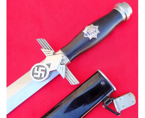 Nazi German R.L.B. 2nd model enlisted man’s dagger and scabbard by WKC Waffenfabrik Solingen. Pommel has the engraved accent 