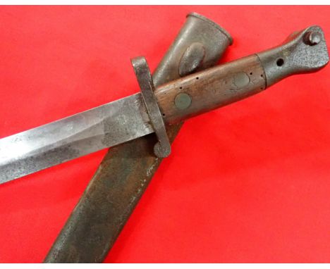 1888 pattern British bayonet and scabbard dated 1901 by Enfield. Features plain wood grips, steel mounted with working lockin