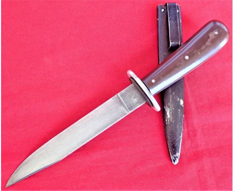 WW2 German boot knife by Puma with clip back steel scabbard. Features contoured bakelite grip scales, retained by three pins,