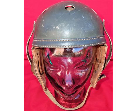 WW2 US Army M38 ‘Tankers’ uniform protective helmet. Compressed card body, covered in olive drab coloured leather and enamel.